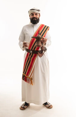 Omani Man in Traditional Dress with Coffee Pot
