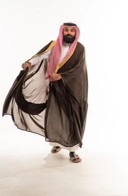 Saudi Man in Traditional Brown Bisht and Shemagh