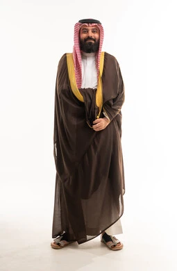 Saudi Man in Traditional Brown Bisht and Shemagh