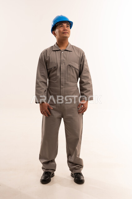 Asian Worker in Uniform and Blue Safety Hard Hat