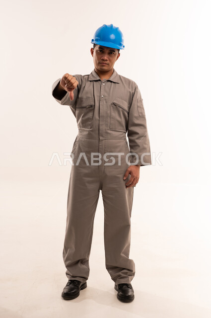 Asian Construction Worker Giving Thumbs Down Gesture