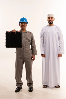 Omani Man and Asian Technician Standing in White Studio