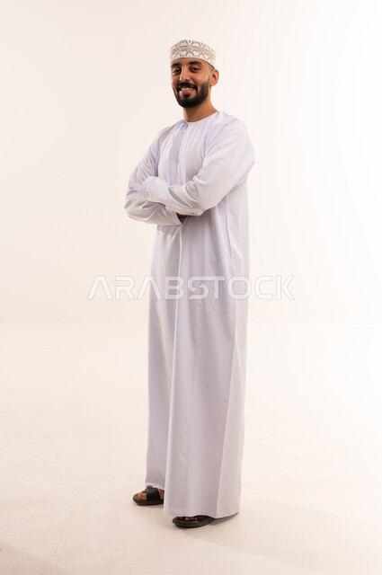 Omani Man in Traditional Dishdasha and Kummah Cap
