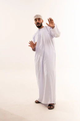 Omani Man in Traditional Dress with Shocked Expression