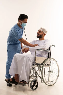 Omani Patient in Wheelchair Medical Exam with Nurse