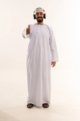 Omani Man in Traditional Dress with Headphones