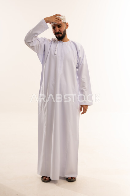 Omani Man in Traditional Dress with Headache