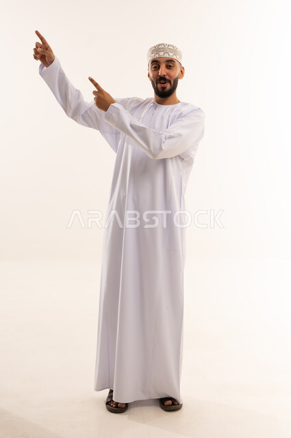 Omani Man in Traditional Dress Pointing on White Background