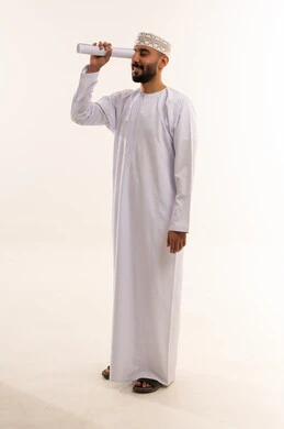Omani Man in Traditional Dishdasha Looking Ahead