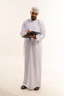 Omani Man Writing on Clipboard in Traditional Dress