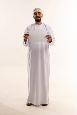 Omani Man in Traditional Dress Holding Blank Sign