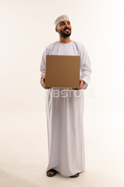 Omani Man Holding Shipping Box on White Background