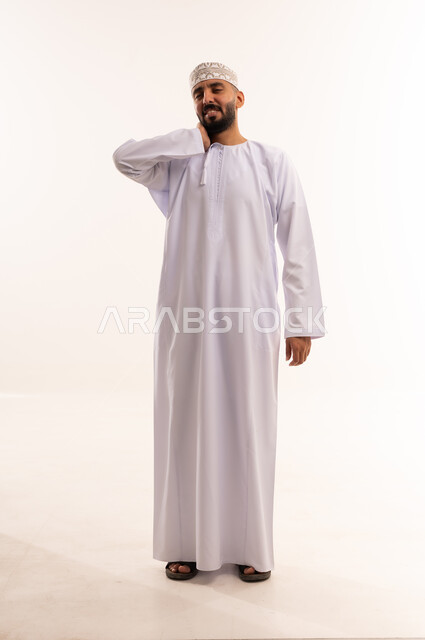 Omani Man in Traditional Dishdasha and Kuma Cap
