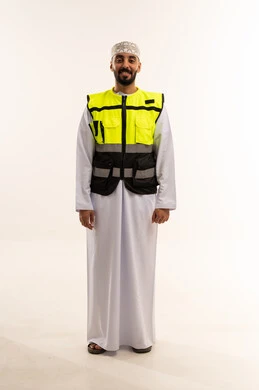 Omani Man in Safety Vest and Traditional Dress