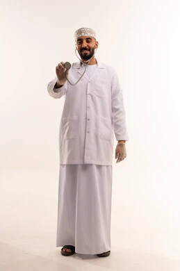 Omani Male Doctor in Medical Lab Coat and Kummah