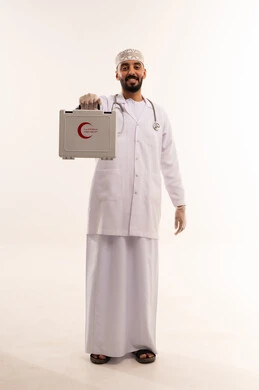 Omani Doctor in Lab Coat Holding First Aid Kit Studio