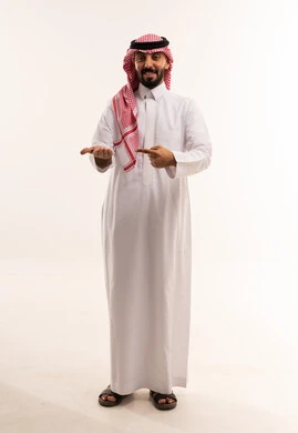Saudi Man in Thobe Pointing at Palm White Background