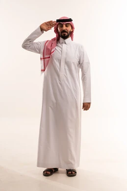 Saudi Man in Traditional Thobe Performing Hand Salute
