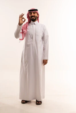 Saudi Man in Traditional Thobe Giving Okay Gesture