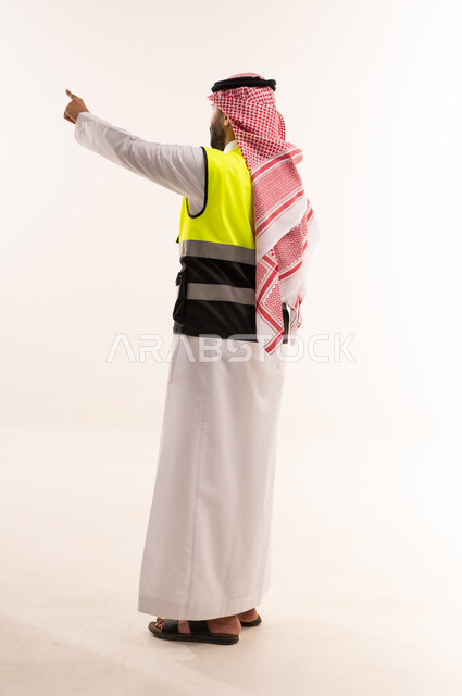 Saudi Man in Safety Vest Pointing on White Background