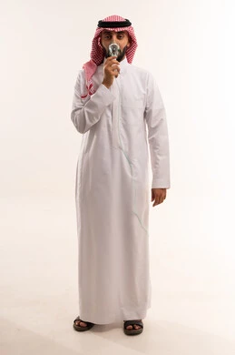 Saudi Man in Traditional Thobe Holding Light Bulb