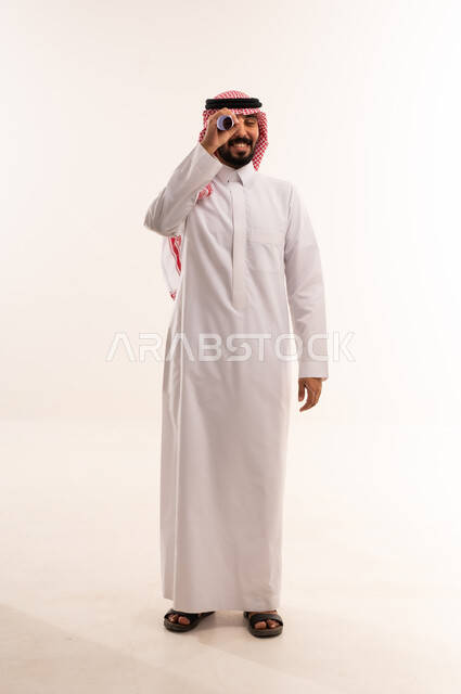 Saudi Man with Telescope in Traditional Dress
