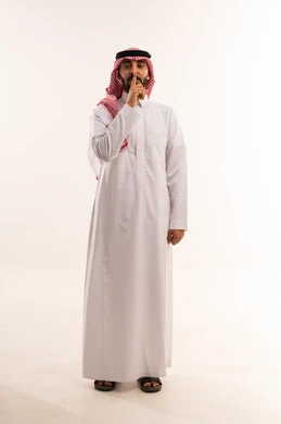 Saudi Man in Traditional Thobe Requesting Silence