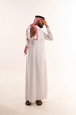 Saudi Man in Thobe Making Stop Gesture with Hand