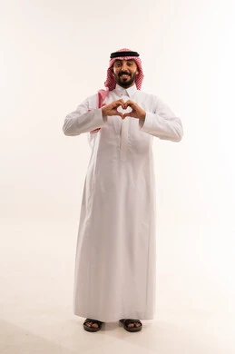 Saudi Man in Traditional Thobe Making Heart Sign