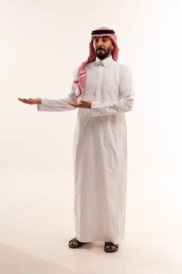 Saudi Man in Traditional Thobe Pointing on White Background