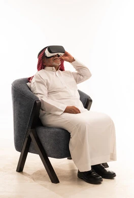 Senior Saudi Man Using VR Headset in Studio