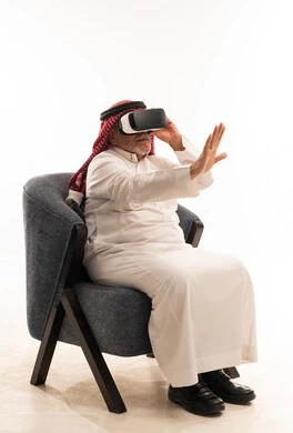 Elderly Saudi Man Using VR Headset in Studio