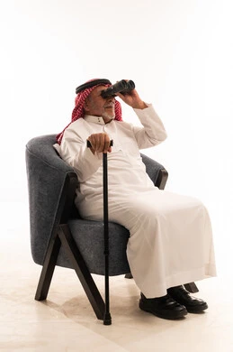 Elderly Saudi Man with Binoculars and Cane in Studio