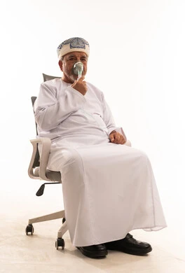 Omani Senior Man Using Oxygen Mask in Studio