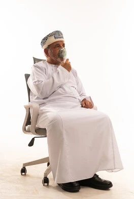 Elderly Omani Man Using Medical Nebulizer Mask