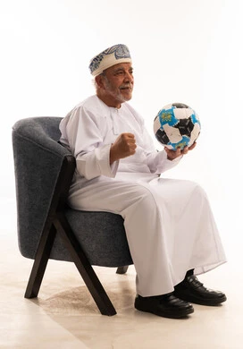 Omani Senior Man with Soccer Ball Celebrating