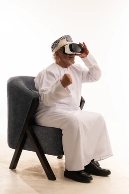 Elderly Omani Man Using Virtual Reality Headset