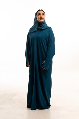 Saudi Woman in Teal Abaya on White Background