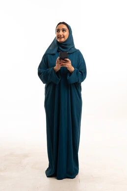 Emirati Woman in Teal Abaya with Smartphone