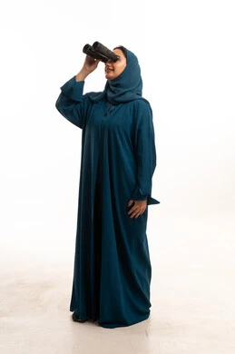 Saudi Woman in Teal Abaya Looking Through Binoculars