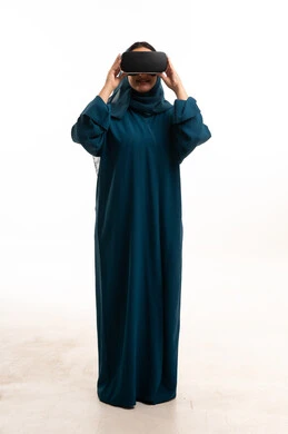 Emirati Woman Wearing Abaya Using VR Headset Studio
