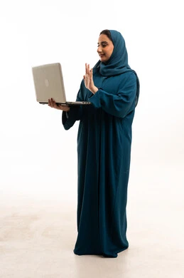 Emirati Woman in Abaya Waving at Laptop Screen