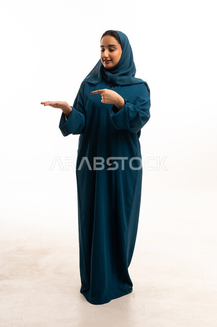 Saudi Woman Pointing at Palm on White Background