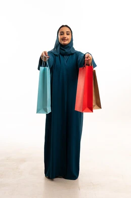 Saudi Woman in Abaya Holding Shopping Bags in Studio