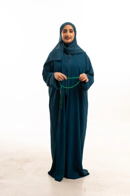 Saudi Woman in Abaya Holding Prayer Beads