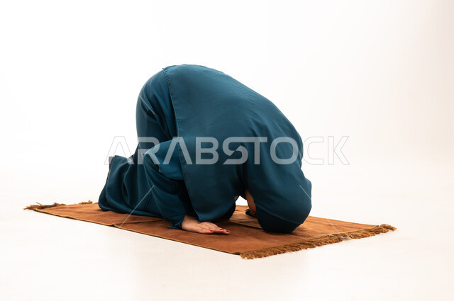 Muslim Woman in Prostration on Prayer Rug
