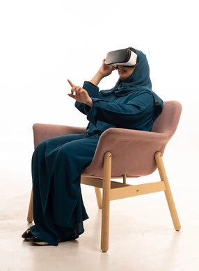 Saudi Woman Using VR Headset on White Background