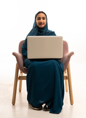 Saudi Woman with Laptop in Modern Teal Abaya