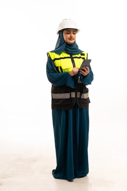 Saudi Female Engineer in Safety Gear Using Smartphone