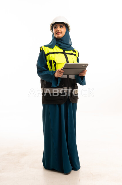 Saudi Female Engineer with Helmet and Tablet